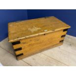 A small pine metal bound chest with carrying handles, 83cm Wide. Much wear