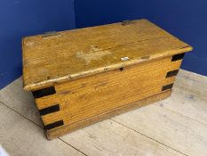 A small pine metal bound chest with carrying handles, 83cm Wide. Much wear