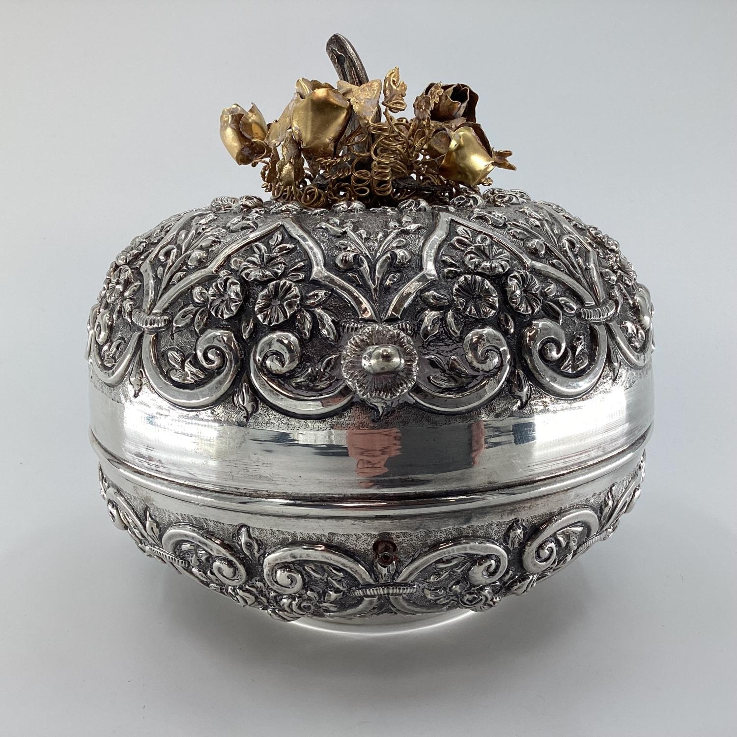 A white metal middle eastern style , circular casket with raised floral decoration, gilt floral - Image 5 of 6