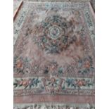 Large C20th Oriental style wool rug, pink and cream ground, 312 x236cm