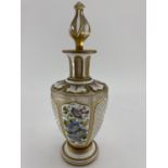 A late C19th/early C20th flash cut glass decanter, Polychrome painted with floral panels