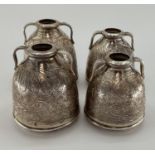 Two pairs of Egyptian white metal decorative water urns, with chased decoration, loop handles and