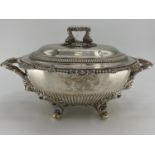 A collection of silver plated items to include two lidded tureens and other items