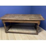 A part C17th oak refrectory table, with old measure marks of 4 ", and worn foot stretcher. Much wear