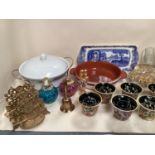 A quantity of decorative tea light holders, plate stands, and gilt metal items