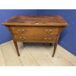 Small two drawer side table on slender tapered legs