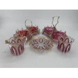 Two cranberry glass and white metal sweet meat serving platters, and two flash cut glass jugs and