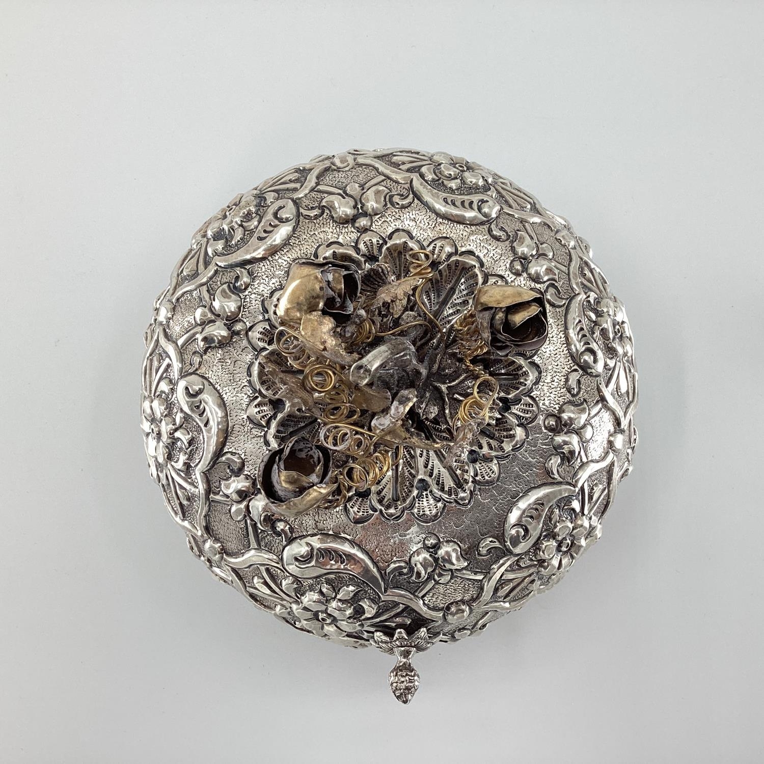 A white metal Middle Eastern style circular casket with raised decoration, gilt floral finial and - Image 2 of 6