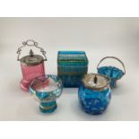 A collection of C20th glass to include two metal topped cranberry glass biscuit tin, metal topped
