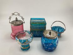 A collection of C20th glass to include two metal topped cranberry glass biscuit tin, metal topped