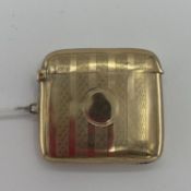 9 ct gold vesta case with engine turned decoration, 24.6g