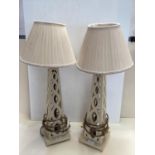 Pair of contemporary decorative cream painted wooden table lamps and cream pleated shades