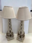 Pair of contemporary decorative cream painted wooden table lamps and cream pleated shades