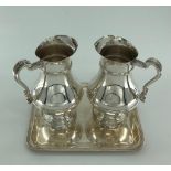 A pair of Christofle white metal water jugs together with a Christofle white metal tray