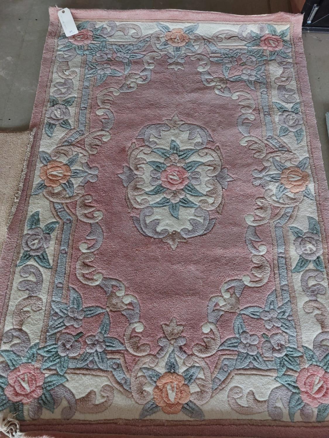 A modern oriental style carpet, pink ground, 120 x 180cm