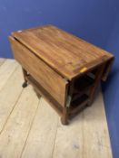 A teak style slatted drop leaf 2 tier kitchen trolley