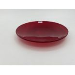 A Nonfoux circular red glass plate, etched and dated to rim 86, approx 31cm diameter