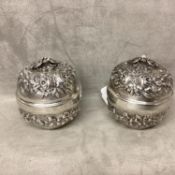 Pair of 900 silver lidded bowls with raised decoration and bird finials, stamped to base 900