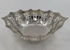 Silver pierced bowl raised on 4 scrolling feet, marked silver, 220grams, 25cmL x 19cmW x 7cmH