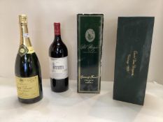 Four bottles to include A Magnum of 2003 Chateau Lagrange Saint-Julien; A Magnum of Joseph Perrier