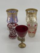 A pair of Moser style gilt goblet, and a some Bohemian style flash cut glass items