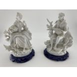 Two C20th bisque figures on blue ceramic bases, unsigned , 35cm H each