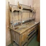 A good oak Arts and Craft style mirrored sideboard, with panelled and galleried top, the base of 3