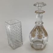 A Baccarat glass decanter with gilt decoration marked to base 30cm, together with a square