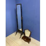 A small and narrow Aesthetic movement black ebonised cheval mirror, and a shield shape mahogany