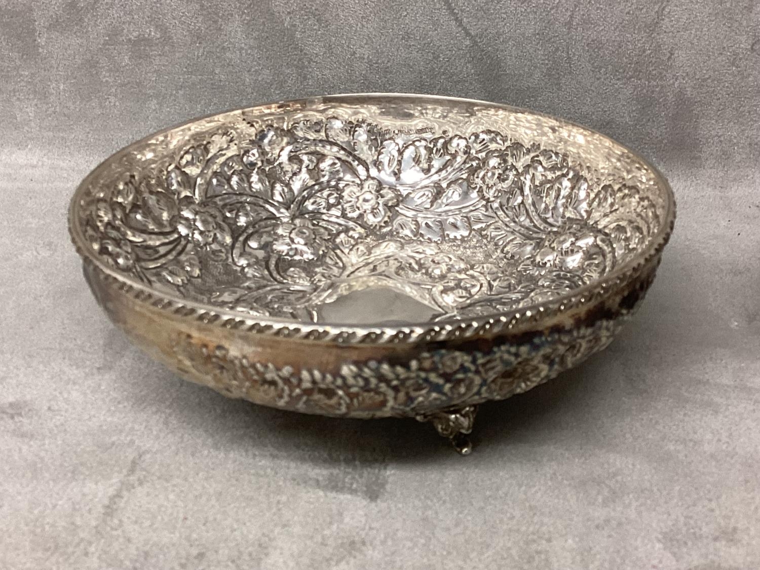 Pair of Middle Eastern white metal bowls with raised floral decoration raised on three feet, 14 x - Image 5 of 5