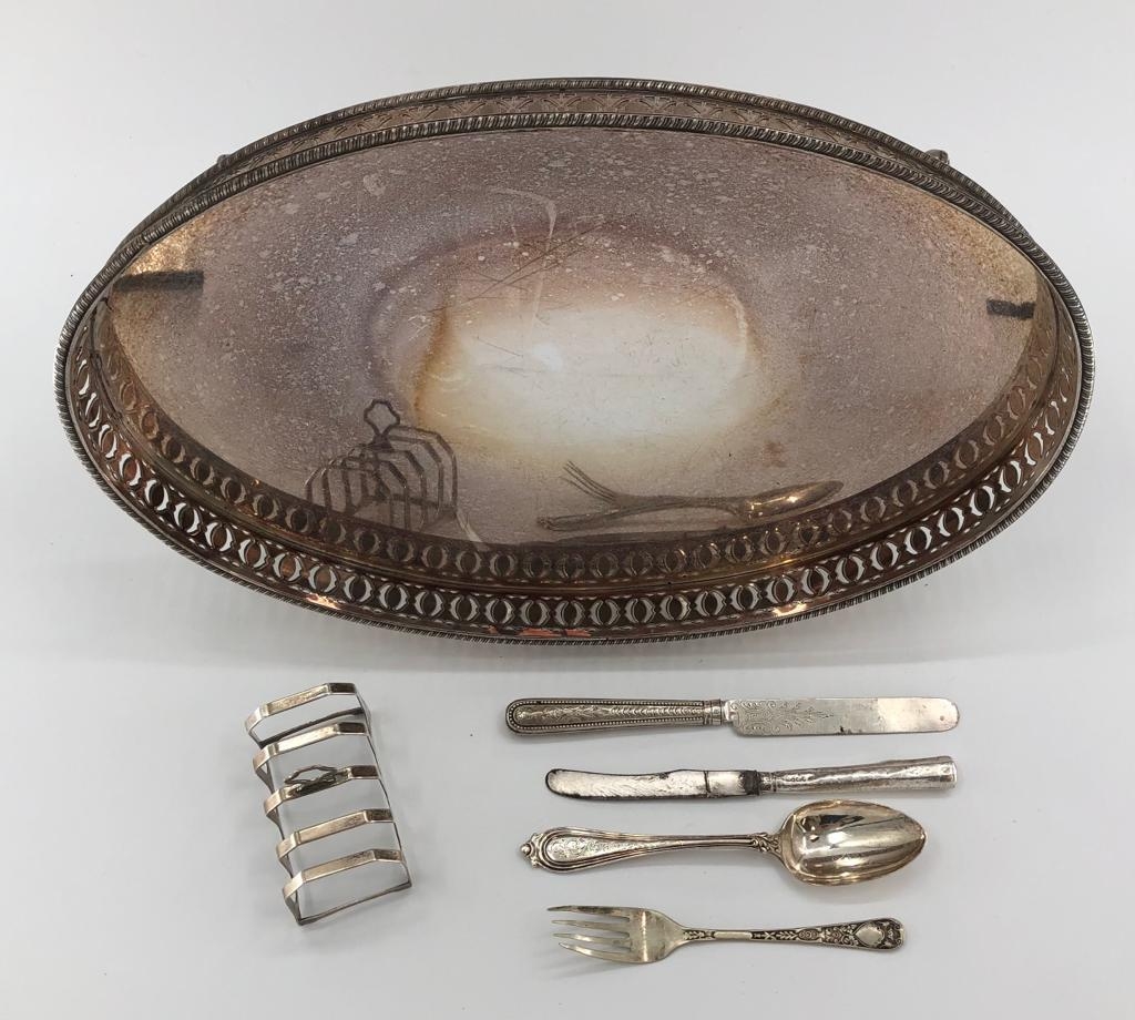 A Sterling Silver toast rack with a mixed selection of Sterling cutlery an oval plated galleried