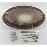 A Sterling Silver toast rack with a mixed selection of Sterling cutlery an oval plated galleried