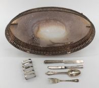 A Sterling Silver toast rack with a mixed selection of Sterling cutlery an oval plated galleried