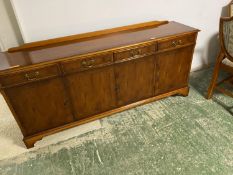 A modern reproduction yew suite of table (with extension), 6 chairs and 2 carvers, and sideboard