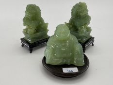 Pair of C20th Jade dogs of fo on hardwood stands, and a jade buddha on circular stand