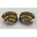 A pair of Turkish silver bowls with cast floral decoration and gilt interior marked Melda Special