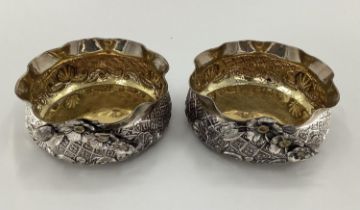 A pair of Turkish silver bowls with cast floral decoration and gilt interior marked Melda Special