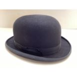 A large sized bowler hat, made by Christys', London size stamped 7 3/8, almost as new