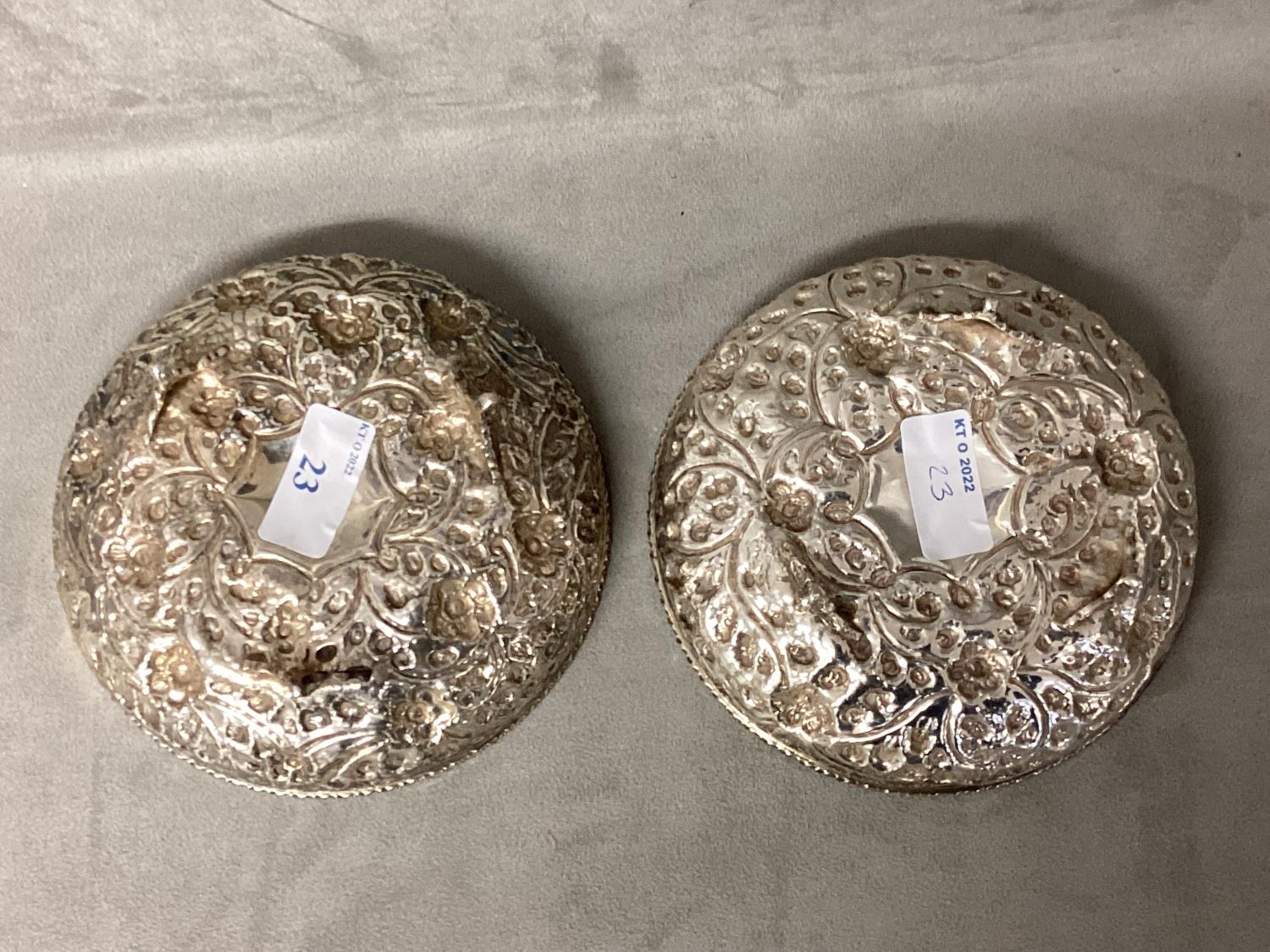 Pair of Middle Eastern white metal bowls with raised floral decoration raised on three feet, 14 x - Image 3 of 5