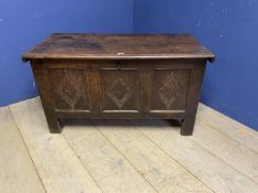 Part C18th oak coffer with 3 carved geometric panels, on raised legs, some splits and wear, 115cm