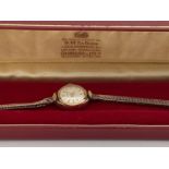 9 ct gold ladies cocktail watch by Garrard on a 9ct gold weaved strap, gross weight is 11.6g