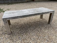 A good solid heavy rustic teak garden plank top table., with parasol hole, general wear and some