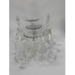 Quantity of glass including modern cake platters on stands, cut glass decanters, wine glasses,