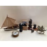 Quantity of mixed collectables including small wooden boat, bronze figure of a bear, two figures