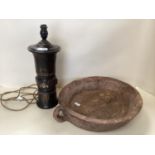 A large rustic wooden bowl, and a table lamp with Champleve decoration