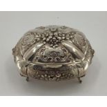 White metal Middle Eastern style domed shaped lidded jewellery casket, decorated with floral design,