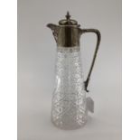 Cut glass and white metal claret jug with star base and etched Victoria Jubilee armorial, 1887, 29cm
