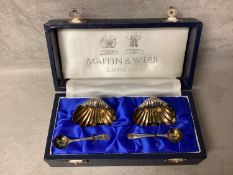 Boxed pair of sterling silver salts and spoons of shell design by Mappin & Webb, London