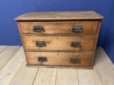 A small pine chest of 3 long drawers