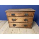 A small pine chest of 3 long drawers